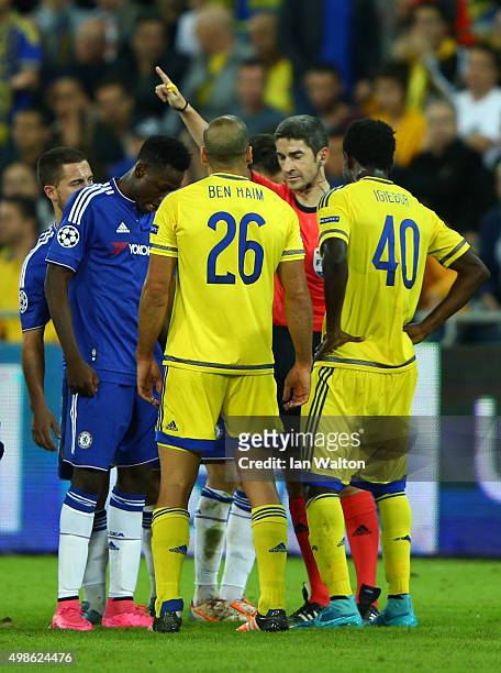 Tal Ben Haim of Maccabi Tel-Aviv is sent off by referee Alberto Undiano Mallenco for a late challenge on Diego Costa of Chelsea during the UEFA...