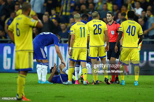 Tal Ben Haim of Maccabi Tel-Aviv is sent off by referee Alberto Undiano Mallenco for a late challenge on Diego Costa of Chelsea during the UEFA...