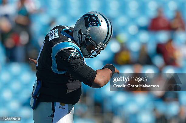 Cam Newton of the Carolina Panthers dances The Dab as he warms up during their game against the Washington Redskins at Bank of America Stadium on...