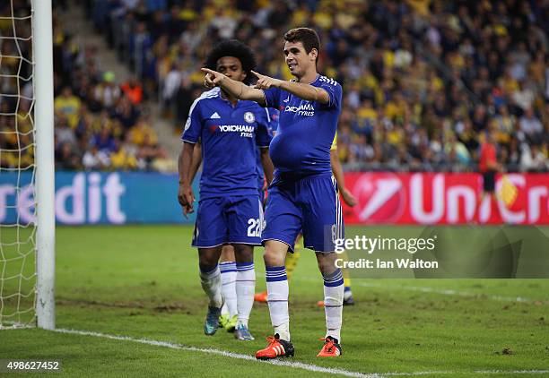 Oscar of Chelsea celebrates scoring his teams third goal during the UEFA Champions League Group G match between Maccabi Tel-Aviv FC and Chelsea FC at...