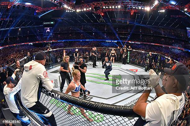 Octagon announcer Bruce Buffer introduces Holly Holm before facing Ronda Rousey in their UFC women's bantamweight championship bout during the UFC...