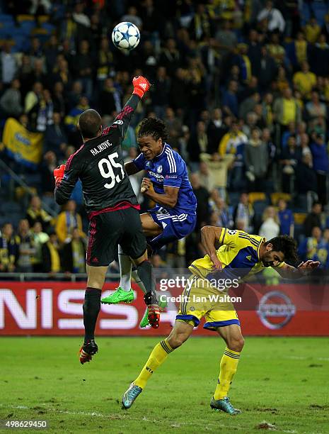 Loic Remy of Chelsea challenges for the ball with goalkeeper Predrag Rajkovic of Maccabi Tel-Aviv during the UEFA Champions League Group G match...