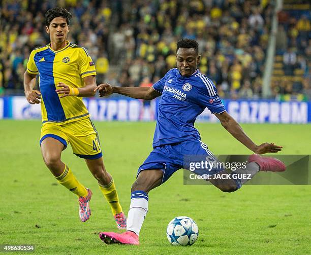 Chelsea's Ghanaian defender Abdul Baba Rahman kicks the ball as Maccabi Tel Aviv's Israeli midfielder Dor Peretz defends during the UEFA Champions...