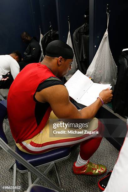 Eric Reid of the San Francisco 49ers looks over the playbook in the locker room prior to the game against the Seattle Seahawks at CenturyLink Field...