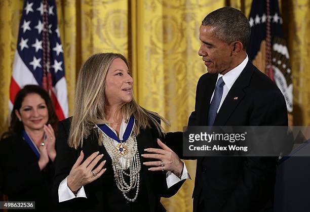 President Barack Obama presents the Presidential Medal of Freedom to singer Barbra Streisand during an East Room ceremony November 24, 2015 at the...