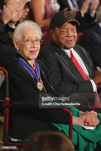 Pioneering NASA mathematician Katherine Johnson and Baseball Hall of Famer Willie Mays are presented with the Presidential Medal of Freedom during a...