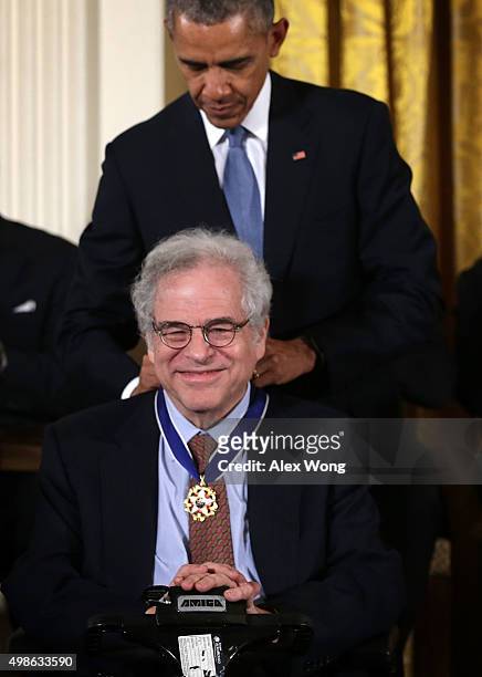 President Barack Obama presents the Presidential Medal of Freedom to conductor Itzhak Perlman during an East Room ceremony November 24, 2015 at the...