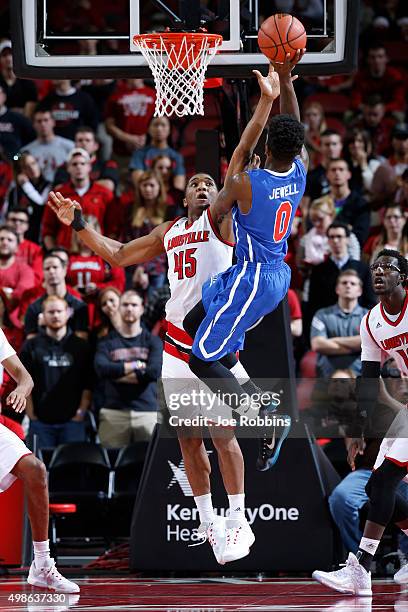 Donovan Mitchell of the Louisville Cardinals defends against Tyreek Jewell of the St. Francis-New York Terriers in the second half of the game at KFC...