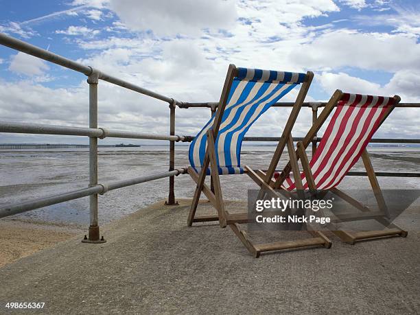 empty seaside deck chairs - void deck stock pictures, royalty-free photos & images
