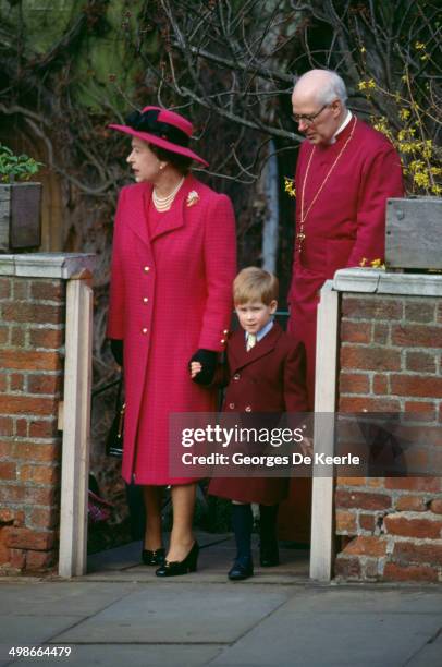 Queen Elizabeth II, young Prince Harry and Michael Mann, the Dean of Windsor after the Royal Easter Service at St George's Chapel, Windsor, 26th...