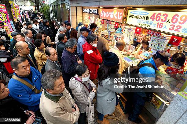 People queue for purchasing tickets of the 'Year-End Jumbo Lottery' at 'Nishiginza Chance Center' on November 25, 2015 in Tokyo, Japan.