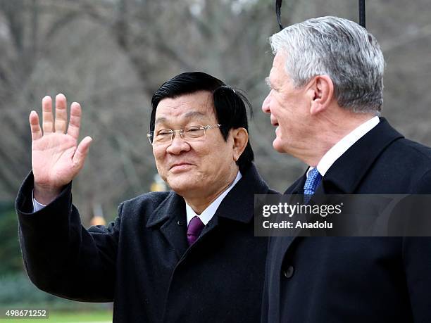 German President Joachim Gauck and Vietnam's President Truong Tan Sang review the honor guards during the welcoming ceremony for an official visit at...