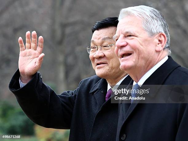 German President Joachim Gauck and Vietnam's President Truong Tan Sang review the honor guards during the welcoming ceremony for an official visit at...