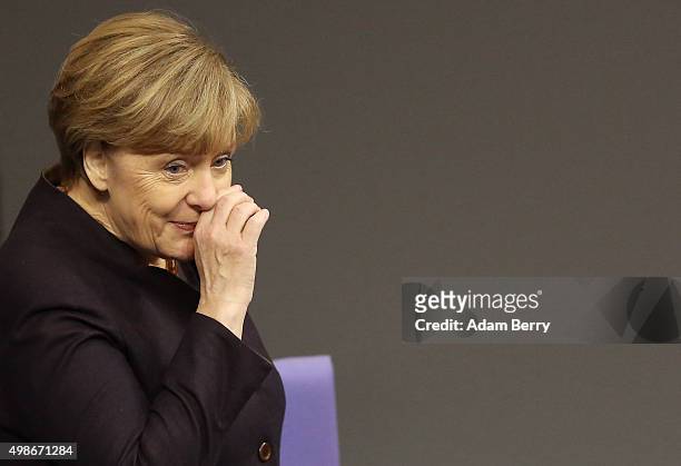 German Chancellor Angela Merkel arrives for a meeting of the Bundestag, the German federal parliament, as its members discuss the country's 2016...
