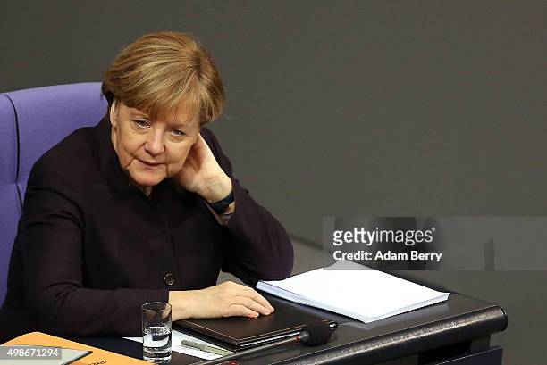 German Chancellor Angela Merkel attends a meeting of the Bundestag, the German federal parliament, as its members discuss the country's 2016 budget...