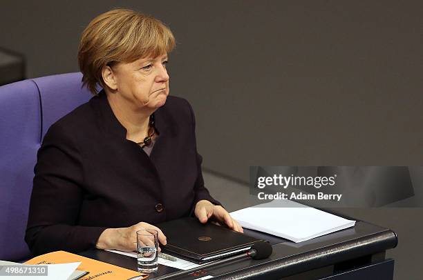 German Chancellor Angela Merkel attends a meeting of the Bundestag, the German federal parliament, as its members discuss the country's 2016 budget...