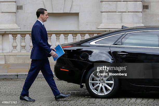 George Osborne, U.K.'s Chancellor of the Exchequer, prepares to get into his car as he departs for the Houses of Parliament to deliver the Autumn...