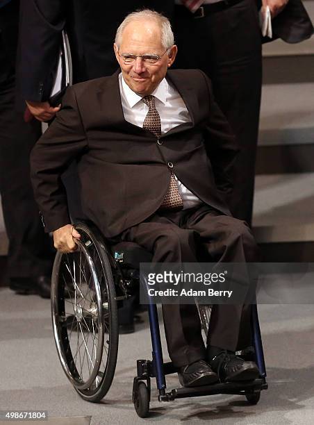 German Finance Minister Wolfgang Schaeuble arrives for a meeting of the Bundestag, the German federal parliament, as its members discuss the...