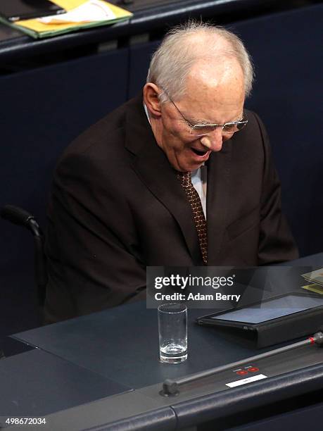 Finance Minister Wolfgang Schaeuble yawns as he attends a meeting of the Bundestag, the German federal parliament, as its members discuss the...