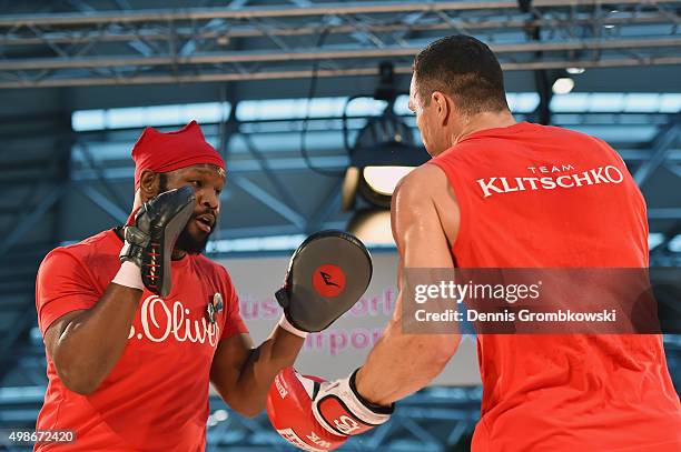 Jonathon Banks reacts as Wladimir Klitschko practices during a Media Training Session at Dusseldorf Airport on November 25, 2015 in Duesseldorf,...