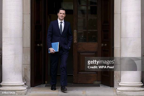 Chancellor of the Exchequer George Osborne leaves the Treasury for the House of Commons to deliver the his Autumn statement, on November 25, 2015 in...