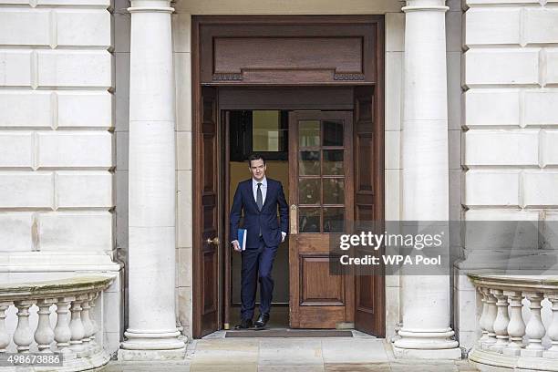 Chancellor of the Exchequer George Osborne leaves the Treasury for the House of Commons to deliver the his Autumn statement, on November 25, 2015 in...