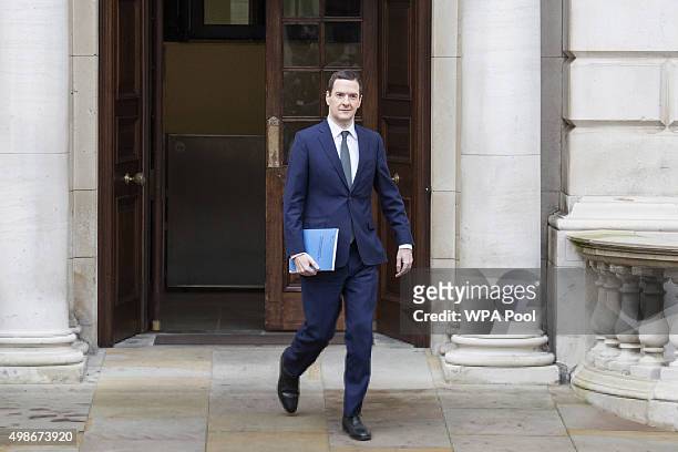 Chancellor of the Exchequer George Osborne leaves the Treasury for the House of Commons to deliver the his Autumn statement, on November 25, 2015 in...