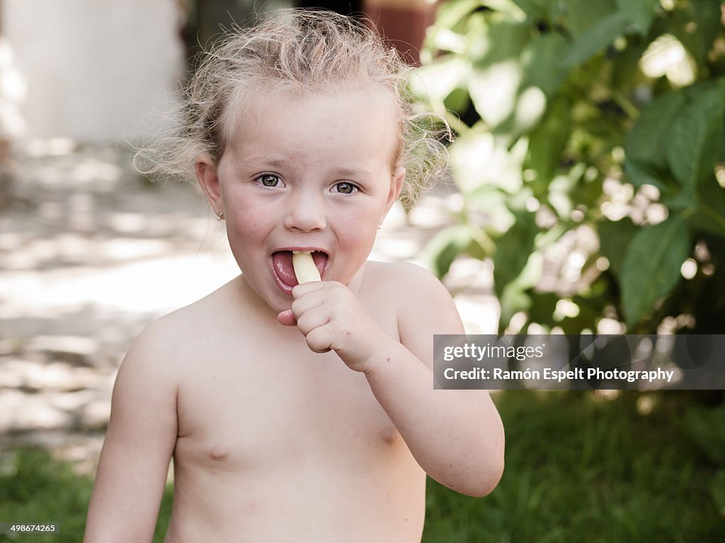Little Blonde Girl Eating An Icecream High-Res Stock Photo - Getty Images