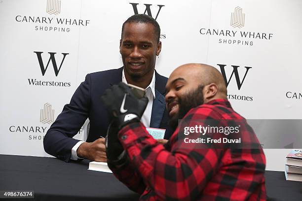 Didier Drogba signs copies of his book "Commitment" at Waterstones Canary Wharf on November 25, 2015 in London, England.