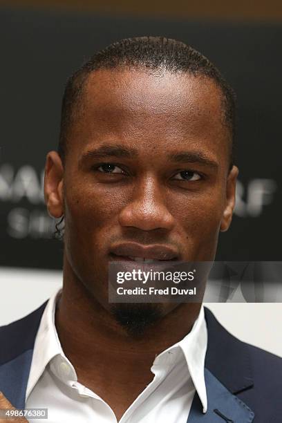 Didier Drogba signs copies of his book "Commitment" at Waterstones Canary Wharf on November 25, 2015 in London, England.