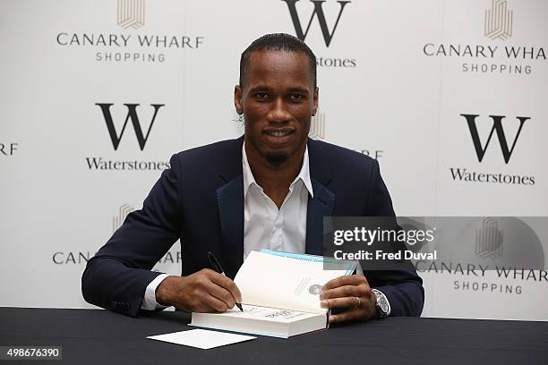 Didier Drogba signs copies of his book "Commitment" at Waterstones Canary Wharf on November 25, 2015 in London, England.
