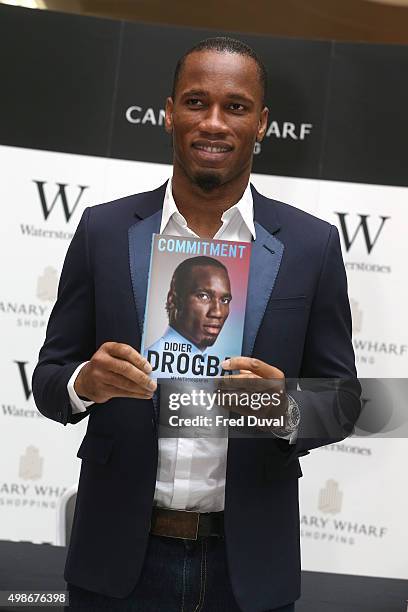 Didier Drogba signs copies of his book "Commitment" at Waterstones Canary Wharf on November 25, 2015 in London, England.