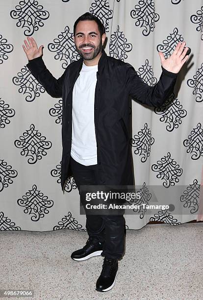 Enrique Santos poses backstage at the Presidente Beer Gente de Zona private concert at the Surfcomber Hotel on November 24, 2015 in Miami Beach,...