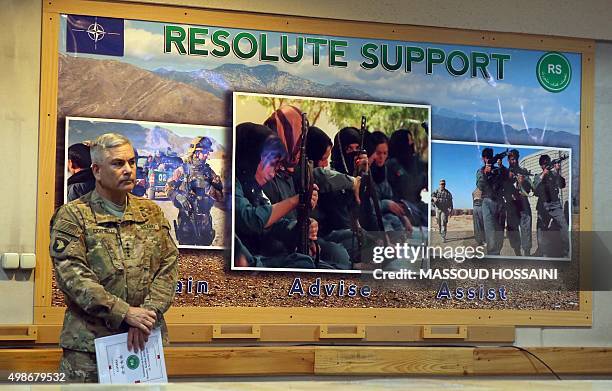 Commander of U.S. And NATO forces in Afghanistan, General John F. Campbell stands before a press conference at Resolute Support headquarters in Kabul...