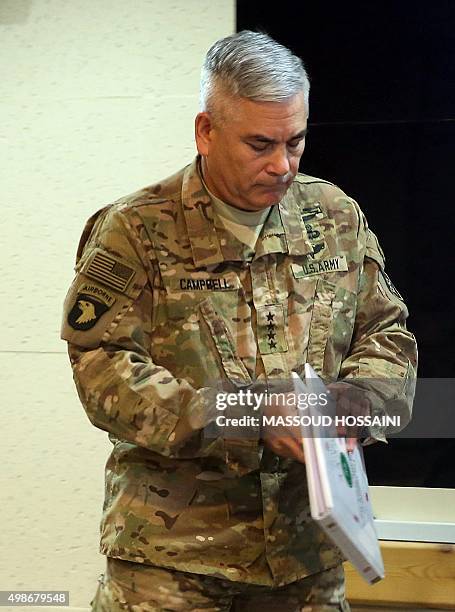 Commander of U.S. And NATO forces in Afghanistan, General John F. Campbell prepares to address a press conference at Resolute Support headquarters in...