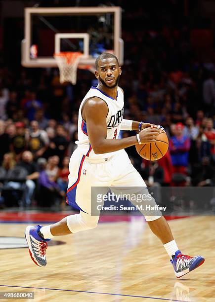 Chris Paul of the Los Angeles Clippers dribbles the ball during a game against the Golden State Warriors at Staples Center on November 19, 2015 in...