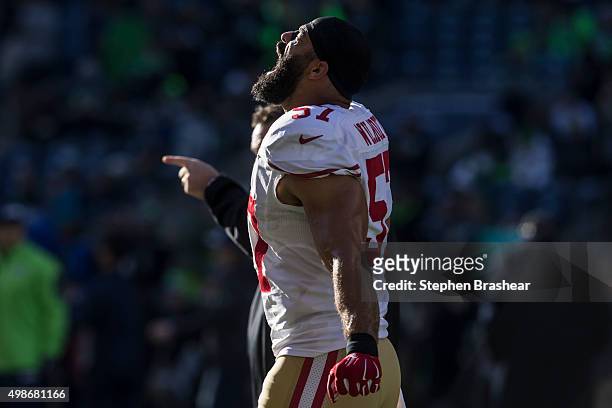 Linebacker Michael Wilhoite of the San Francisco 49ers yells while walking off the field before the football game against the Seattle Seahawks at...