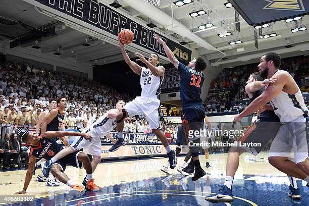 Joe McDonald of the George Washington Colonials drives to the basket during a college basketball game against the Virginia Cavaliers at the Smith...
