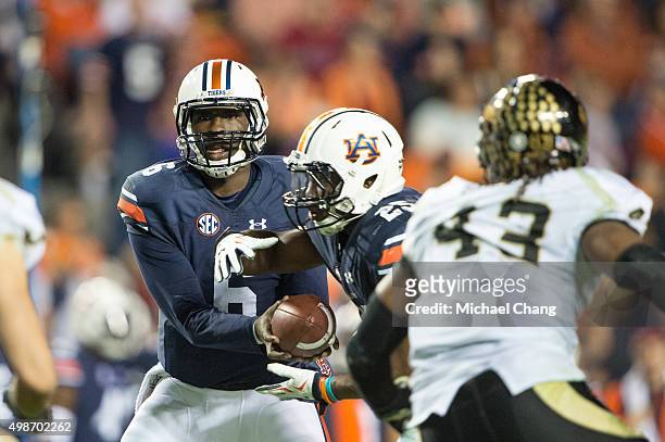 Quarterback Jeremy Johnson of the Auburn Tigers hands the ball off to running back Peyton Barber of the Auburn Tigers during their game against the...