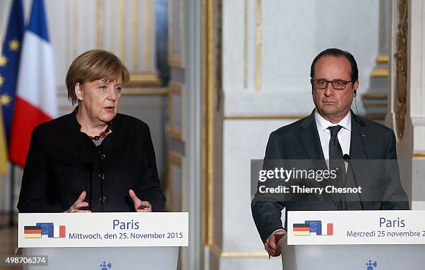 German Chancellor Angela Merkel delivers a speech next to the French President Francois Hollande during a press conference at the Elysee Presidential...