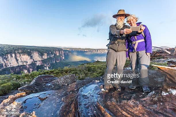 senior couple bushwalker selfie in spectacular landscape - great dividing range stock pictures, royalty-free photos & images