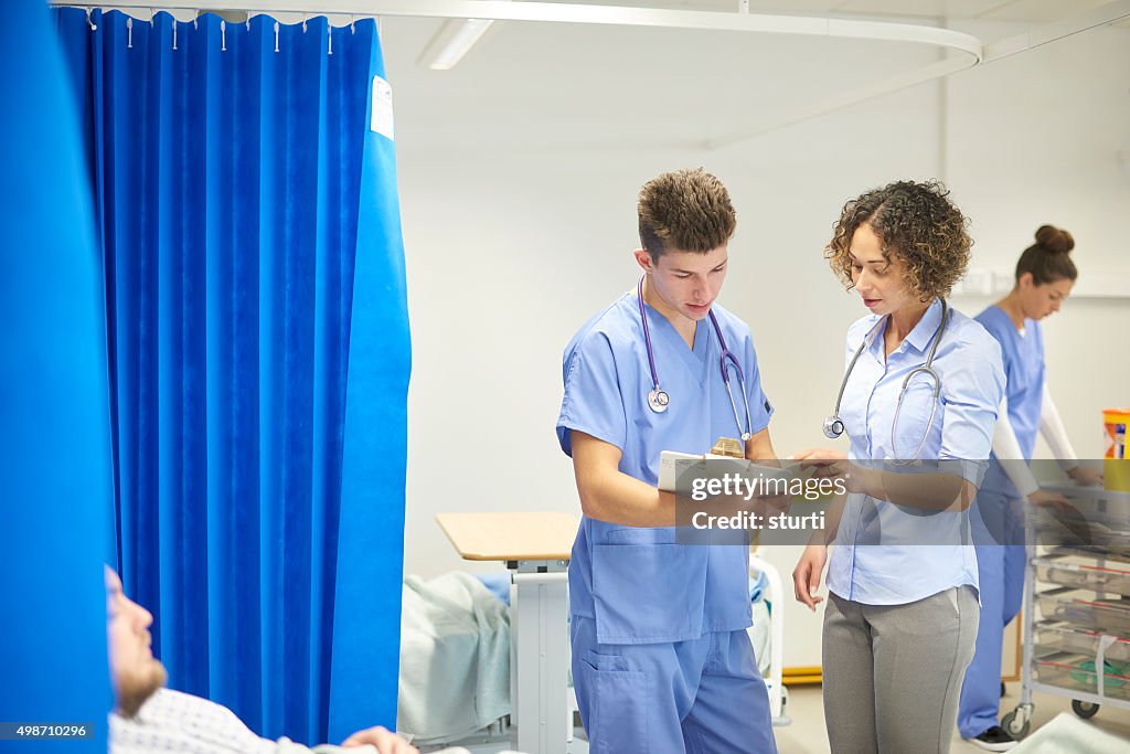 Male and female doctors on the hospital ward
