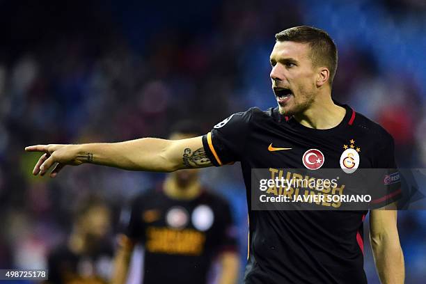 Galatasaray's German forward Lukas Podolski gestures during the UEFA Champions League Group C football match Club Atletico de Madrid vs Galatasaray...