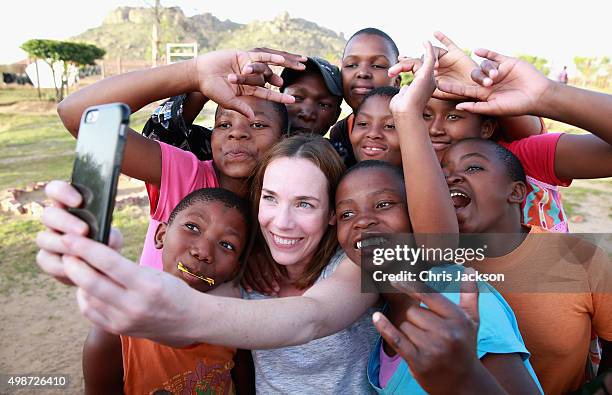 Actress Laura Main meets children at Phelisanong Children's Home during a Sentebale programme visit on November 25, 2015 in Phelisanong, Lesotho....