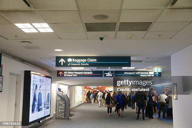 arrivals at sydney international airport - kingsford smith airport stock pictures, royalty-free photos & images