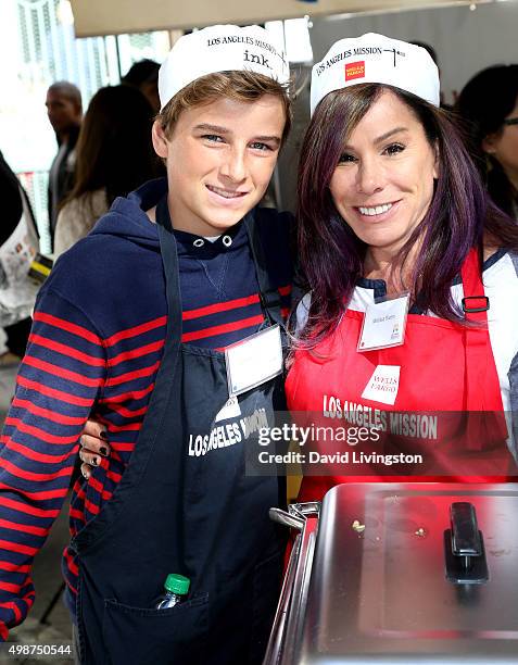 Personality Melissa Rivers and son Cooper Endicott attend Thanksgiving for the Homeless at Los Angeles Mission on November 25, 2015 in Los Angeles,...