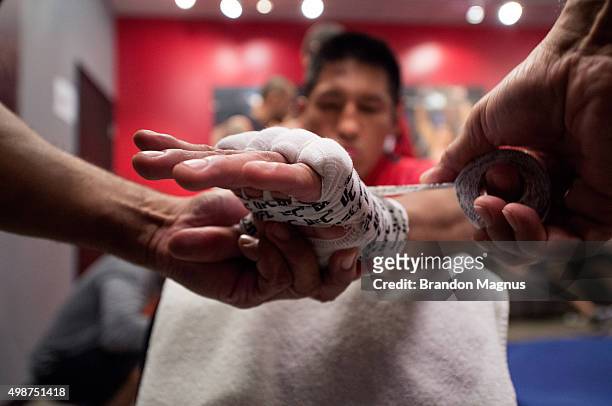 Enrique Barzola gets his hands wrapped before facing Cesar Arsamendia in their semi-finals fight during the filming of The Ultimate Fighter Latin...