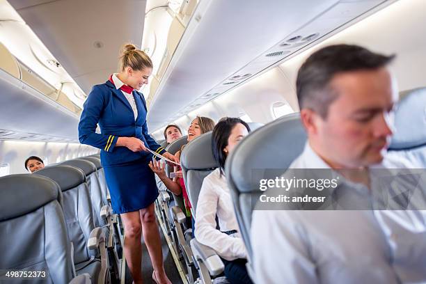 duty free service onboard - stewardess stock pictures, royalty-free photos & images