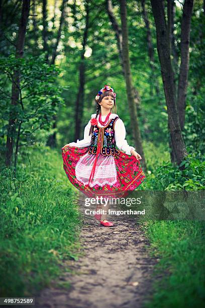 cute little girl in polish folk costume (cracow region) - traditional dances stock pictures, royalty-free photos & images