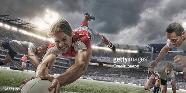 rugby player in mid air scores with heroic dive - rugby union stock pictures, royalty-free photos & images